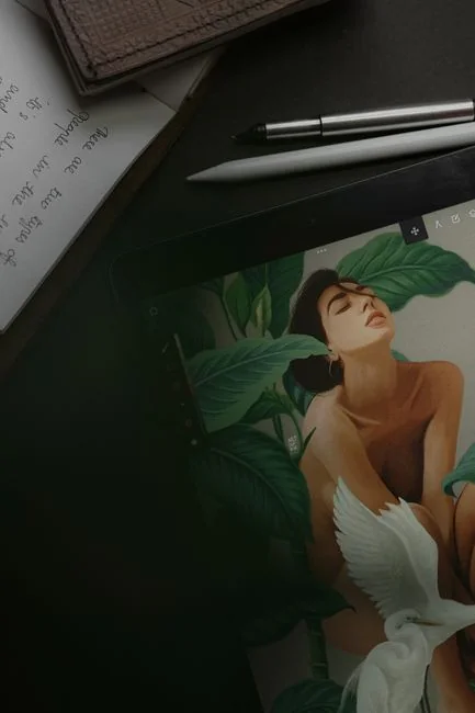 Woman using smartphone for online shopping with credit card in hand, festive background lighting.